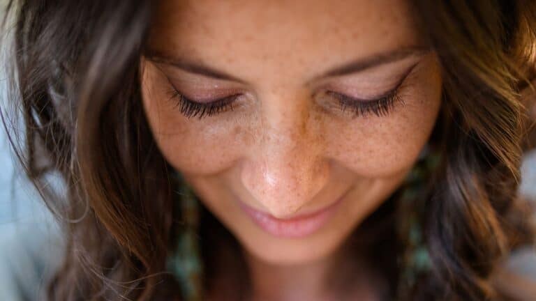 Young woman with freckles closeup