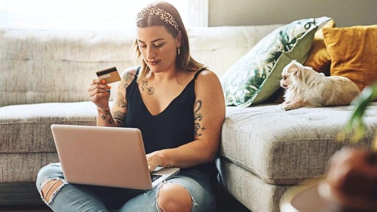 Young woman shopping online in her living room
