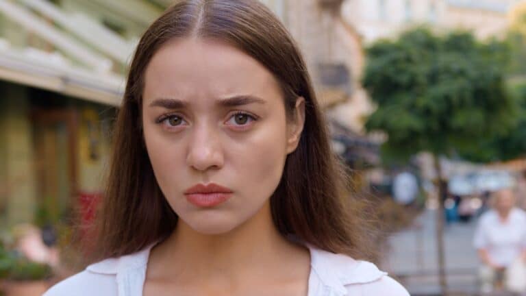 Young brunette woman looking annoyed