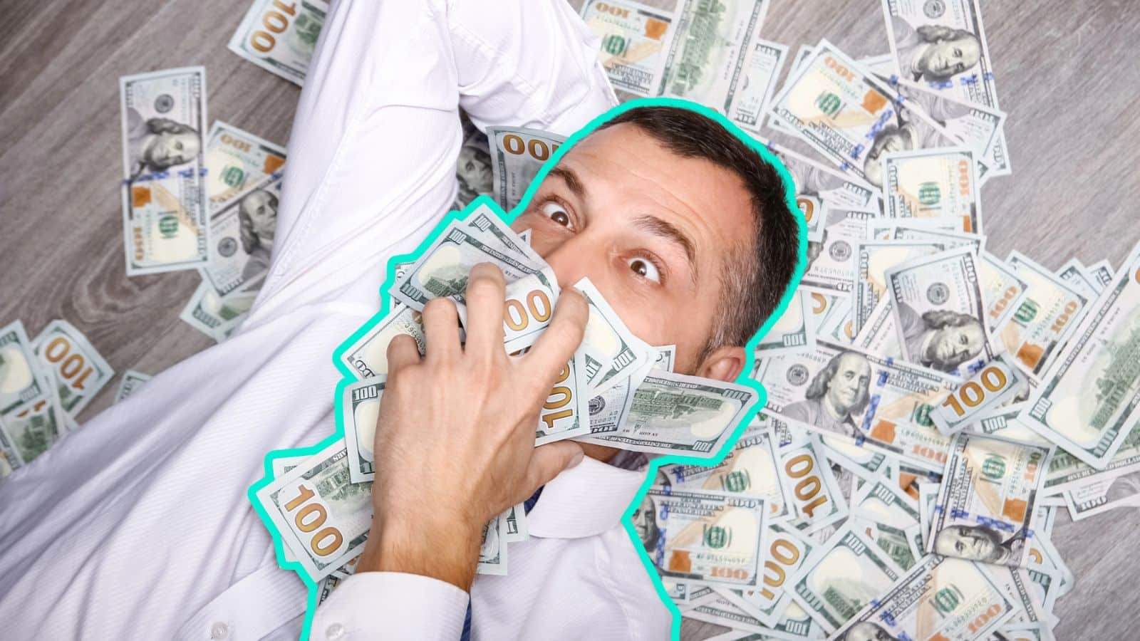 Wealthy man laying on the ground covered in money