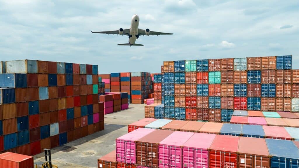 Shipping yard filled with rail cars stacked high
