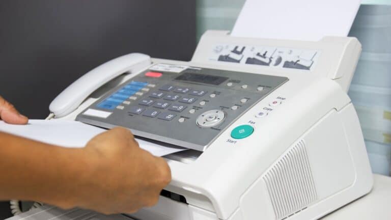 Person using a fax machine