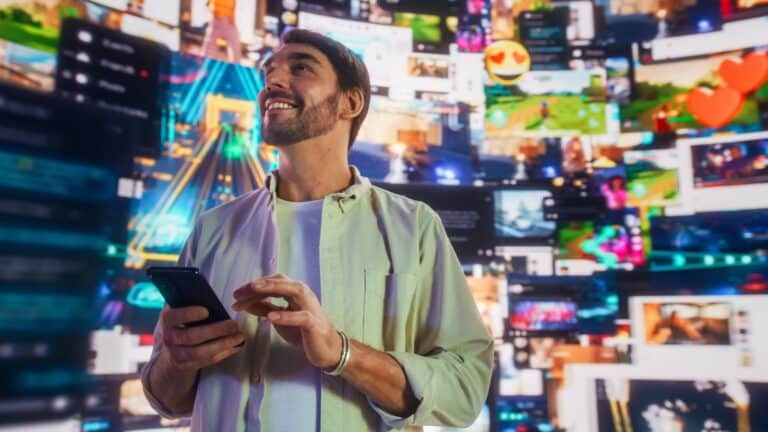 Man looking happy with videos playing all around him