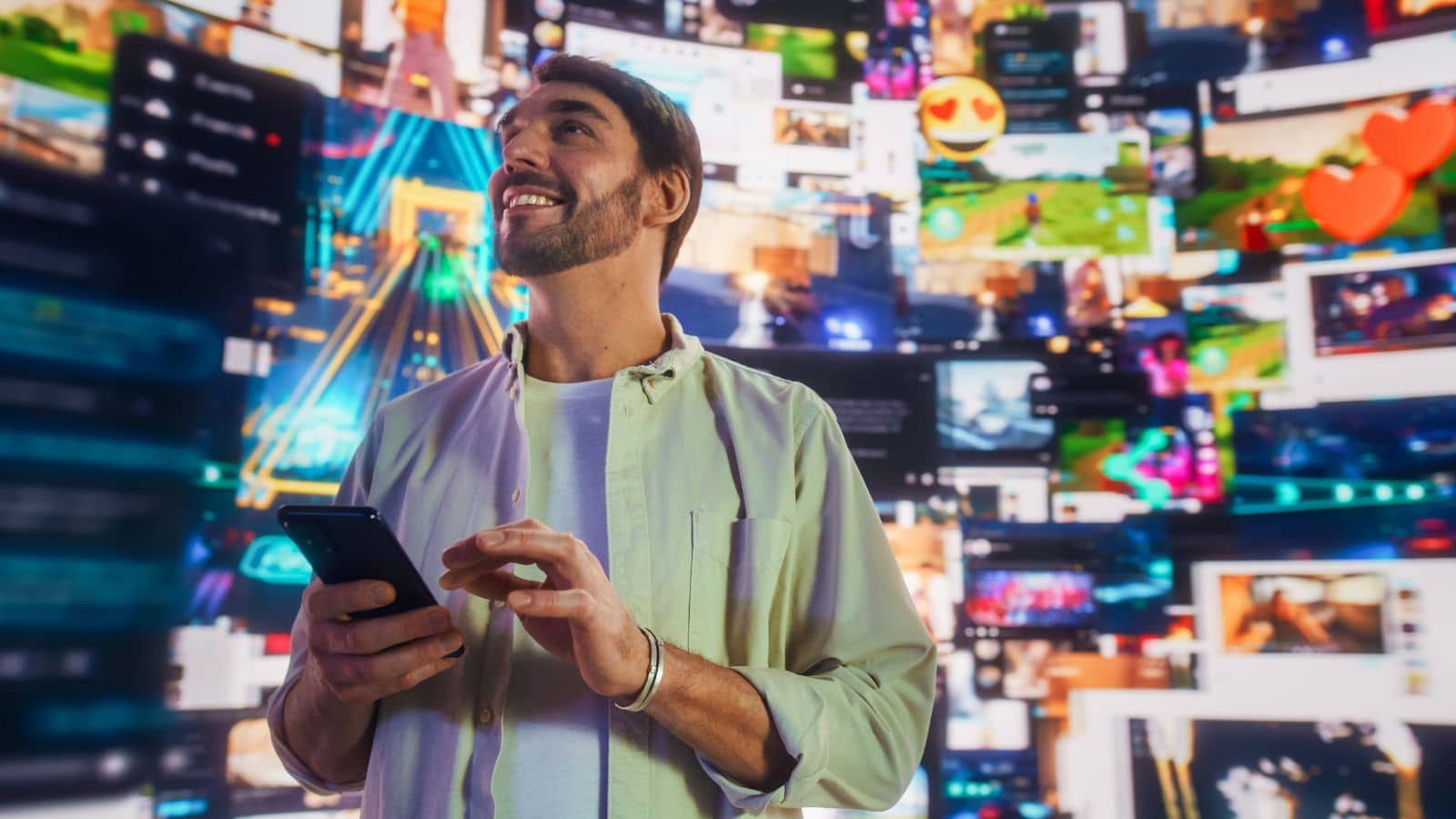 Man looking happy with videos playing all around him