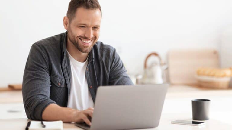 Happy man working on his laptop