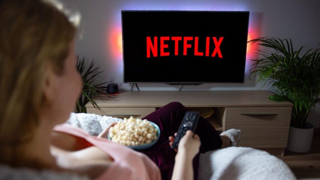 Woman watching Netflix on her TV