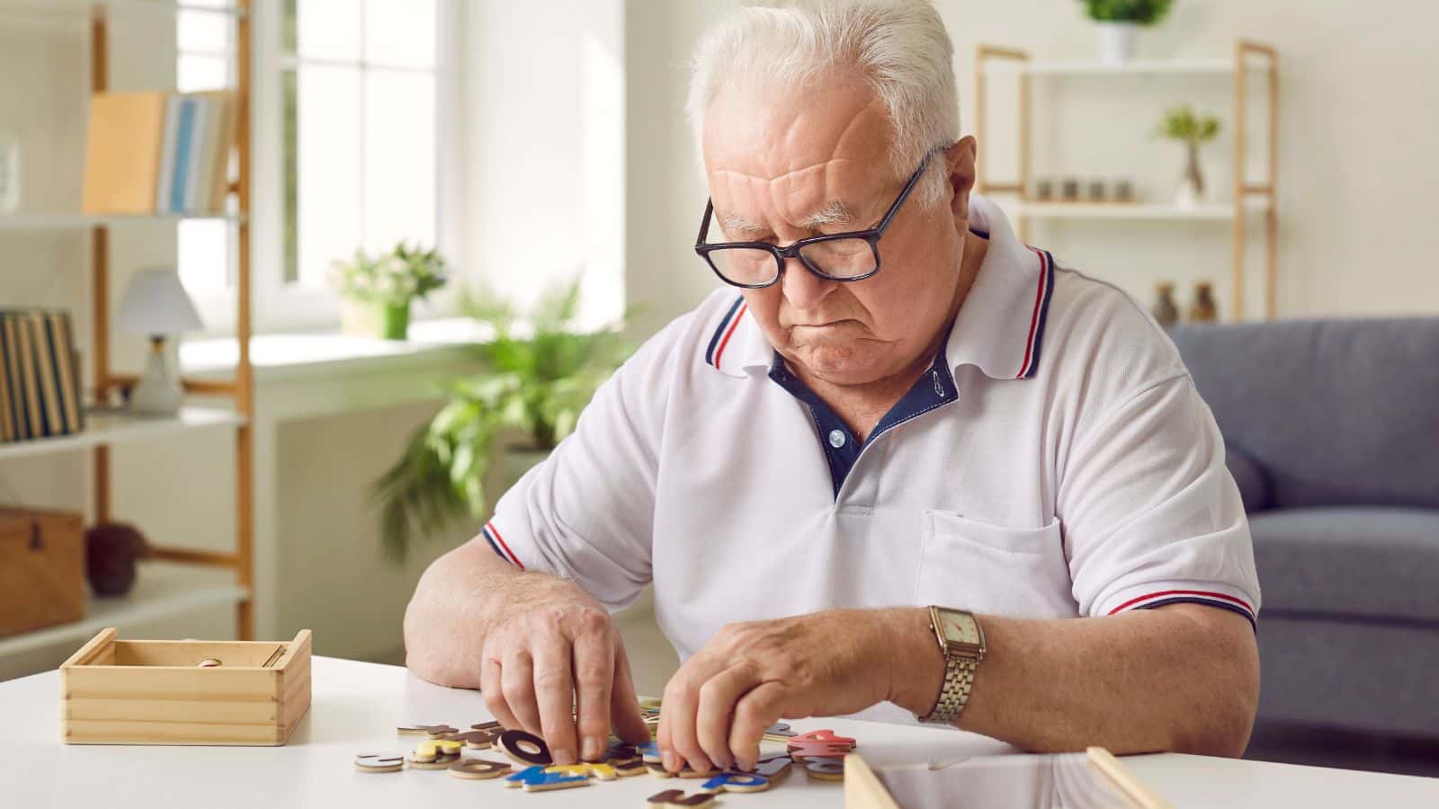 Older man doing a puzzle