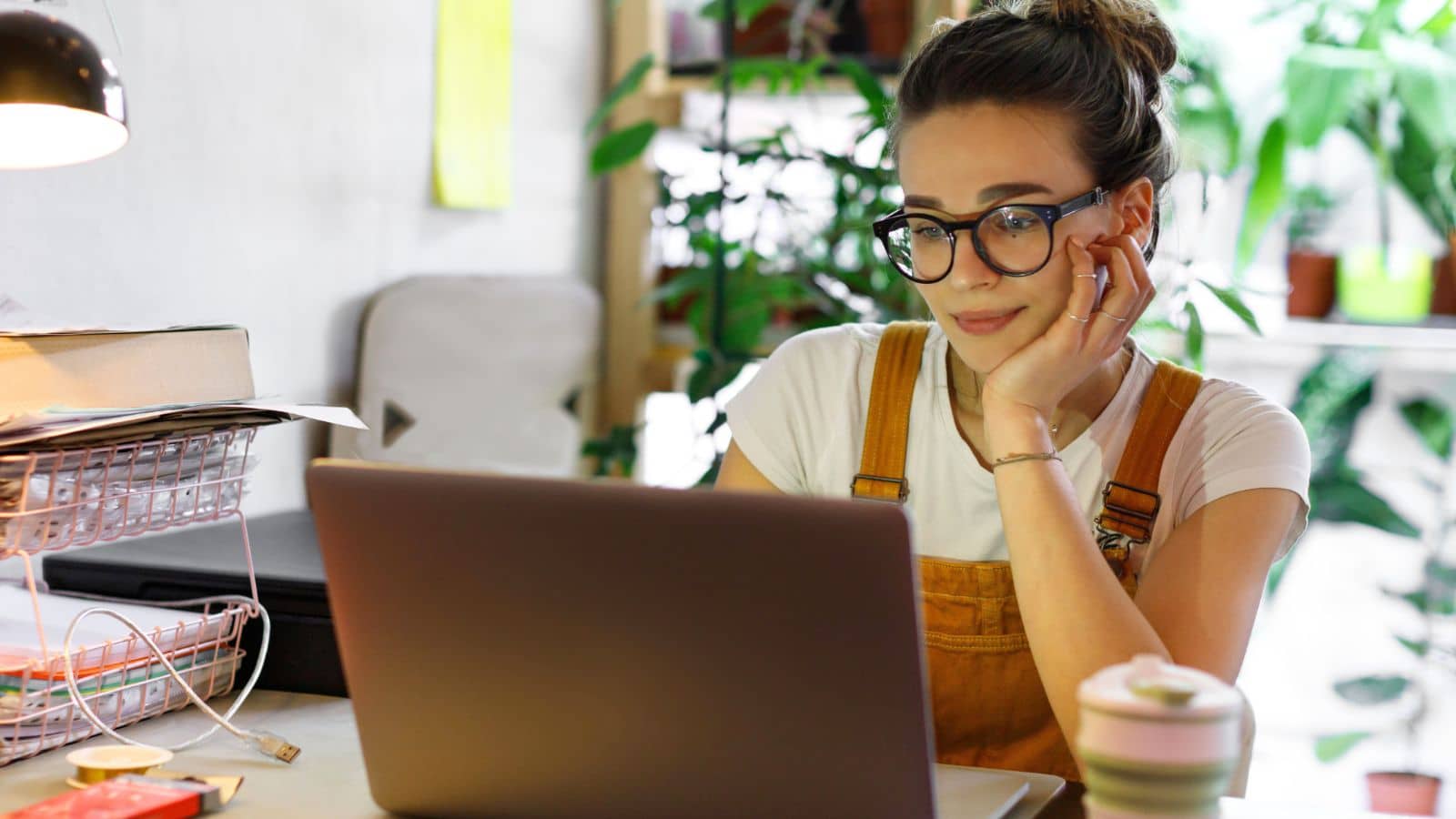 Young woman working remotely at her laptop