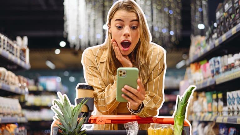 Young woman looking shocked in the grocery store