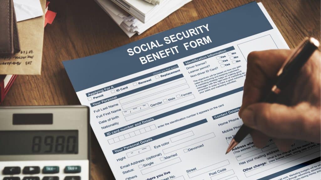 Person filling out a social security benefit form