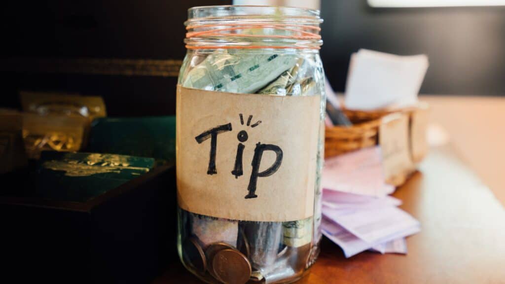 Tip jar filled with cash