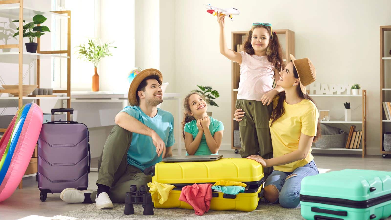 Family packing for vacation and looking excited
