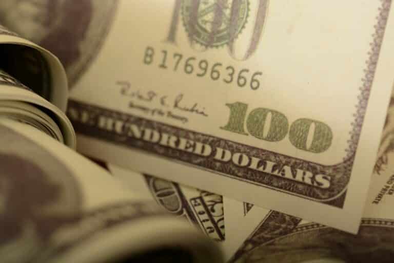 Closeup of 0 bill and coins