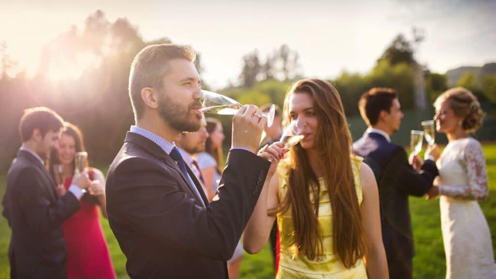 Wedding guests drinking champagne
