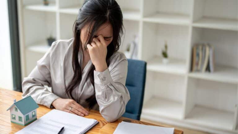 Woman stressed while buying a house