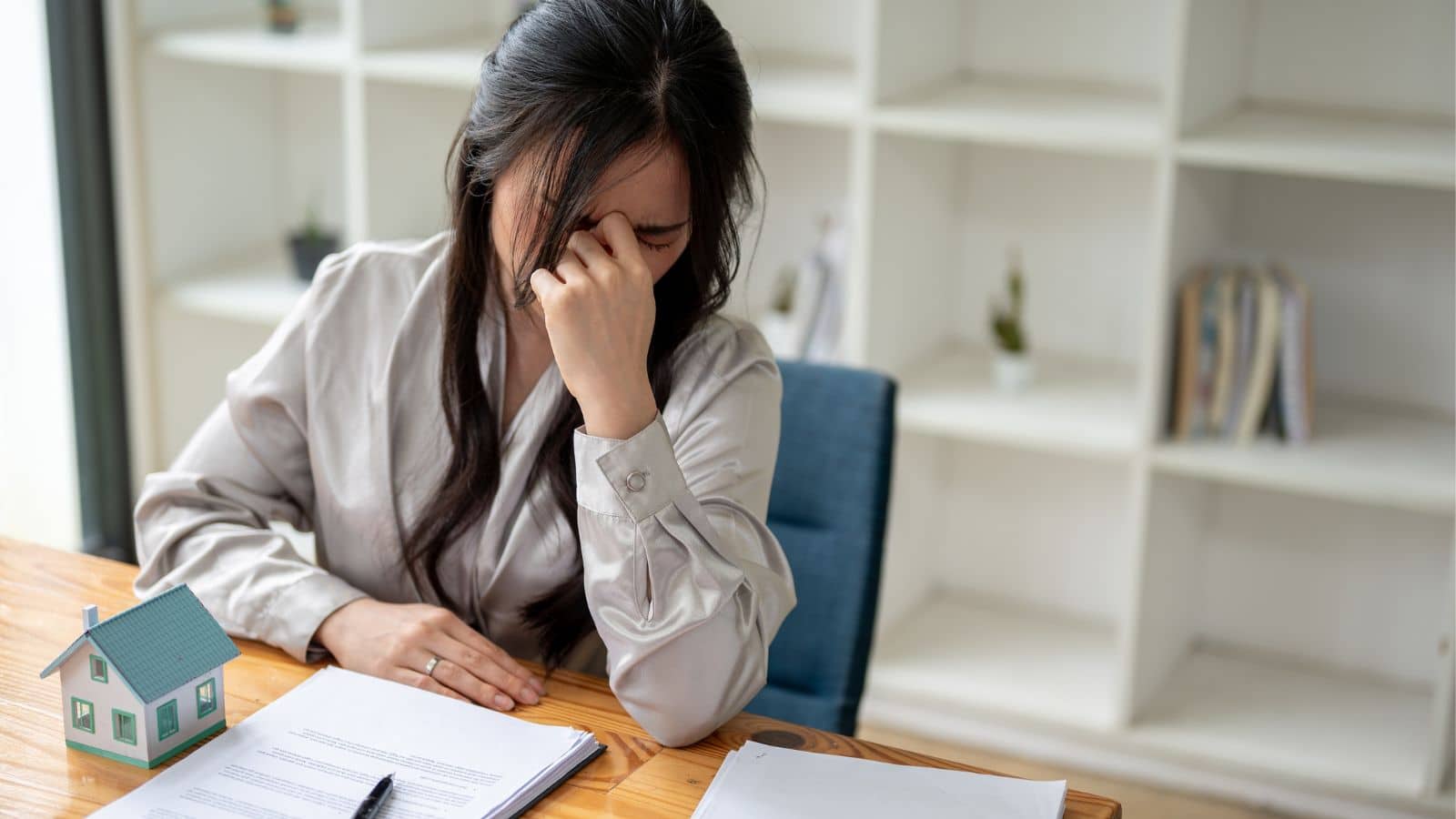 Woman stressed while buying a house