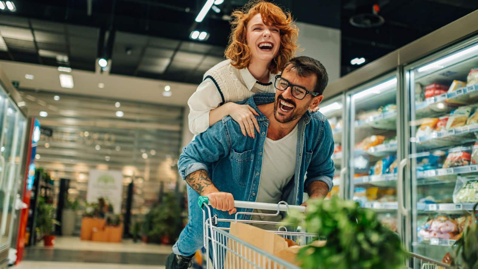 Couple riding a cart in a store