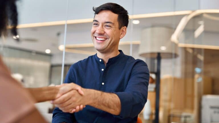 Man shaking a woman's hand