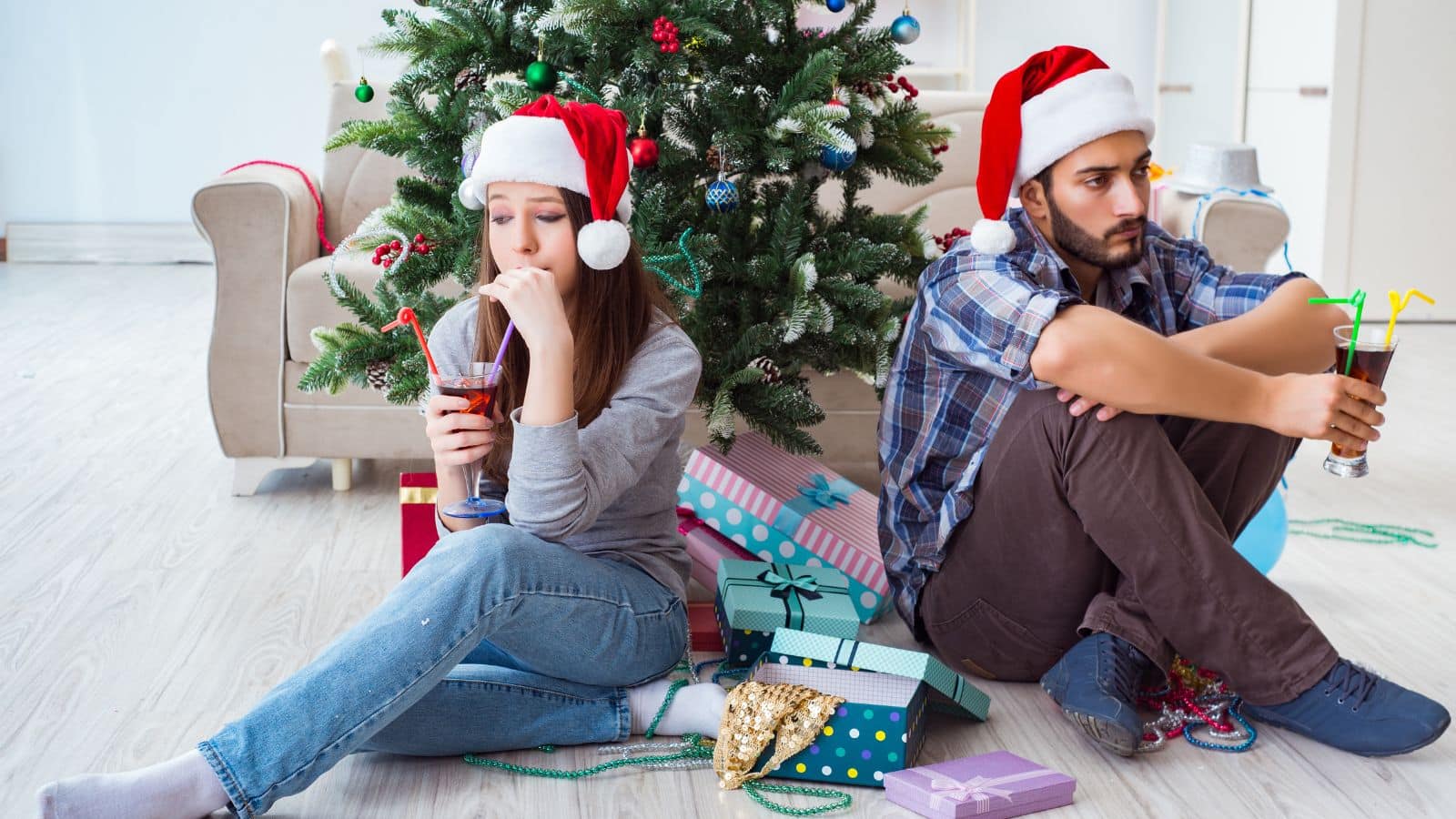 Couple fighting in front of the Christmas tree