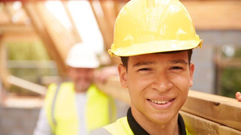 Teenage boy doing construction work