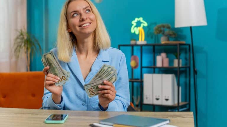 Blonde woman counting money