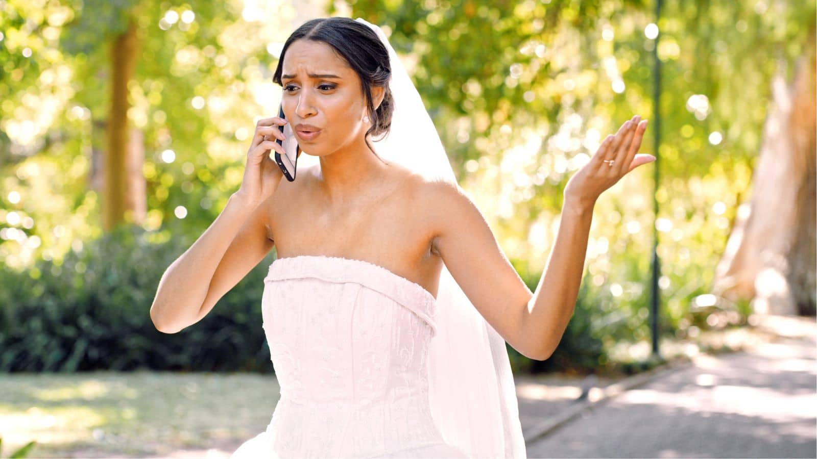 Bride looking upset while talking on the phone
