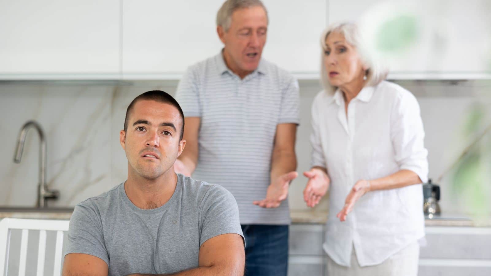 Man arguing with his older parents