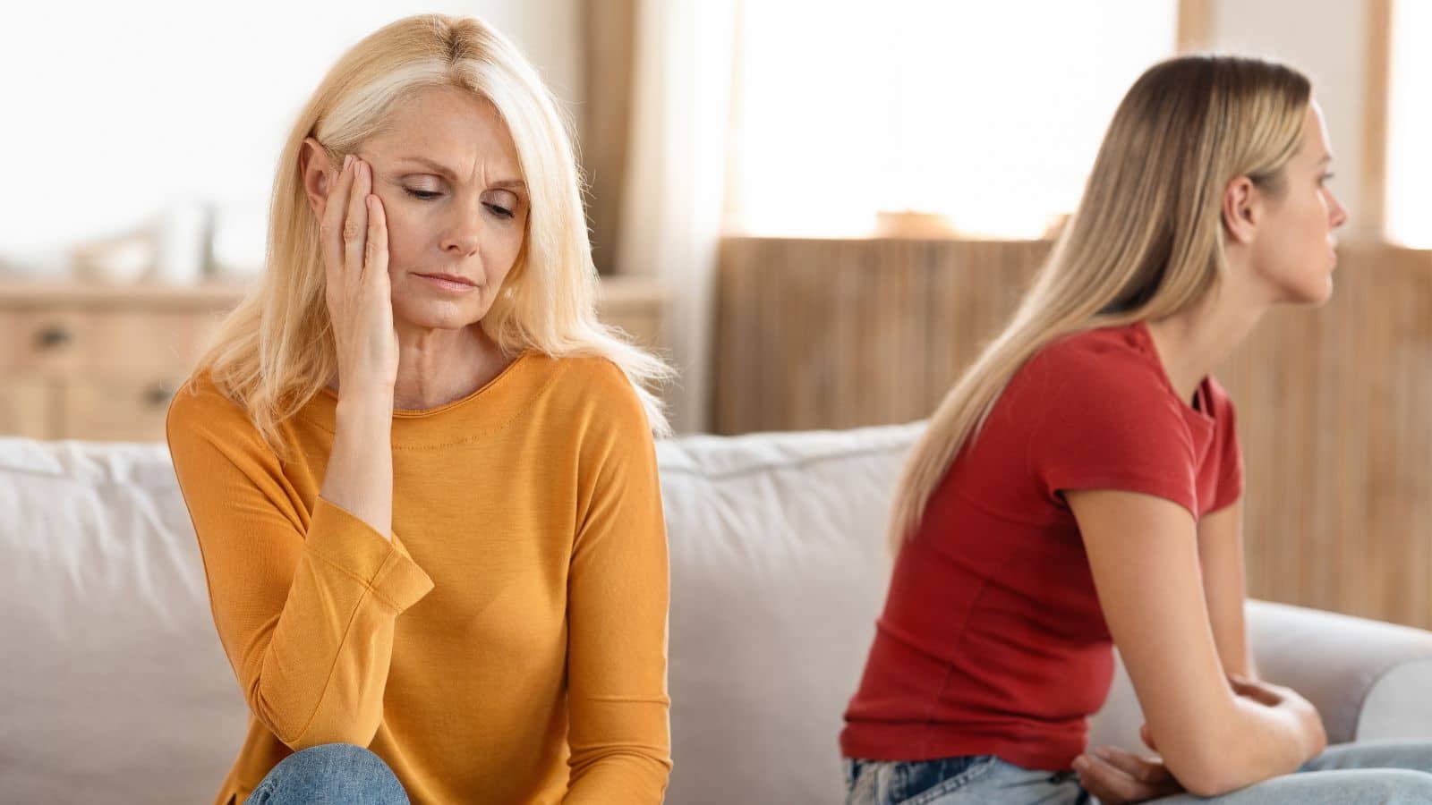 Mom and daughter looking upset with one another