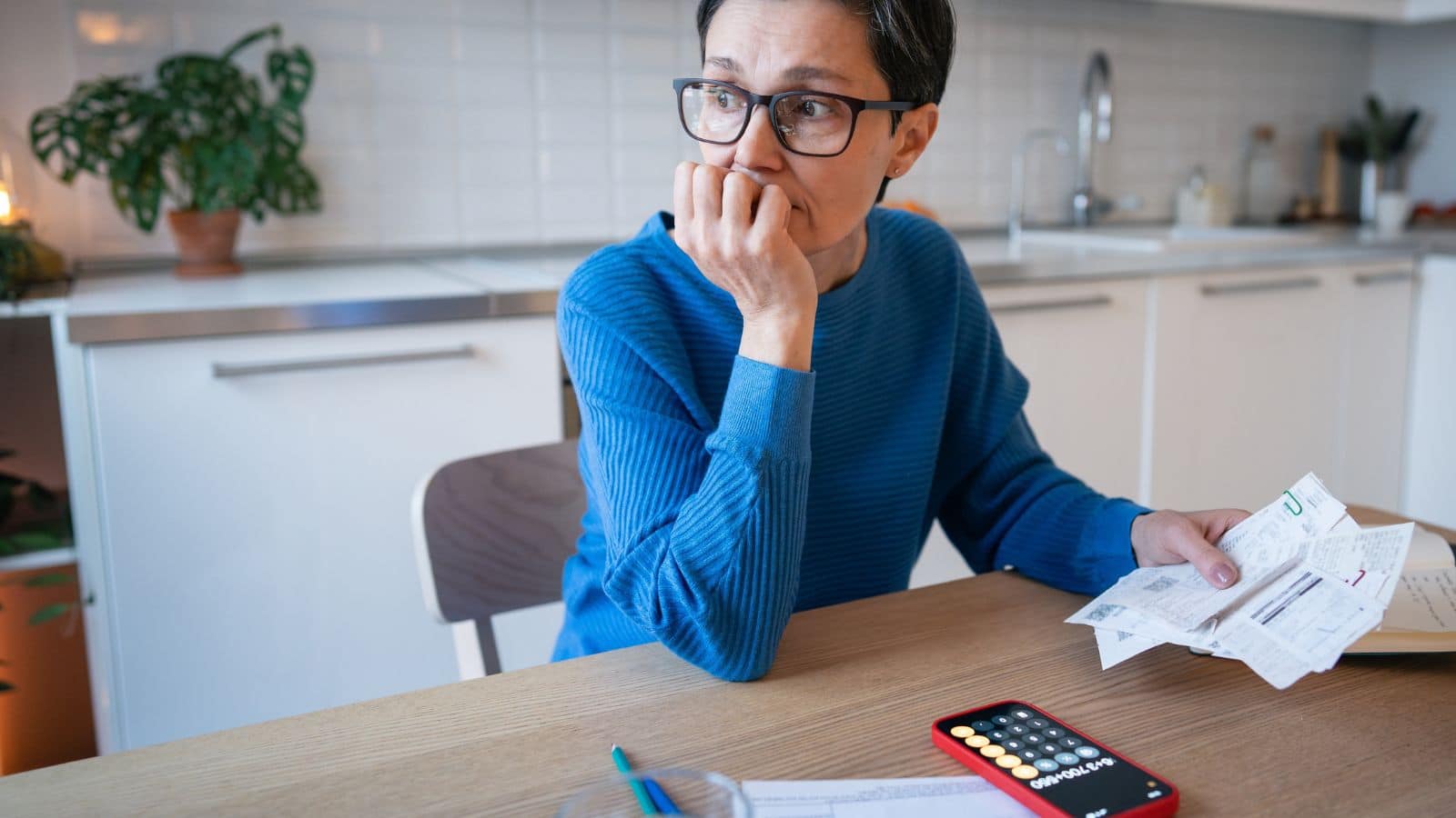 Woman looking stressed over finances