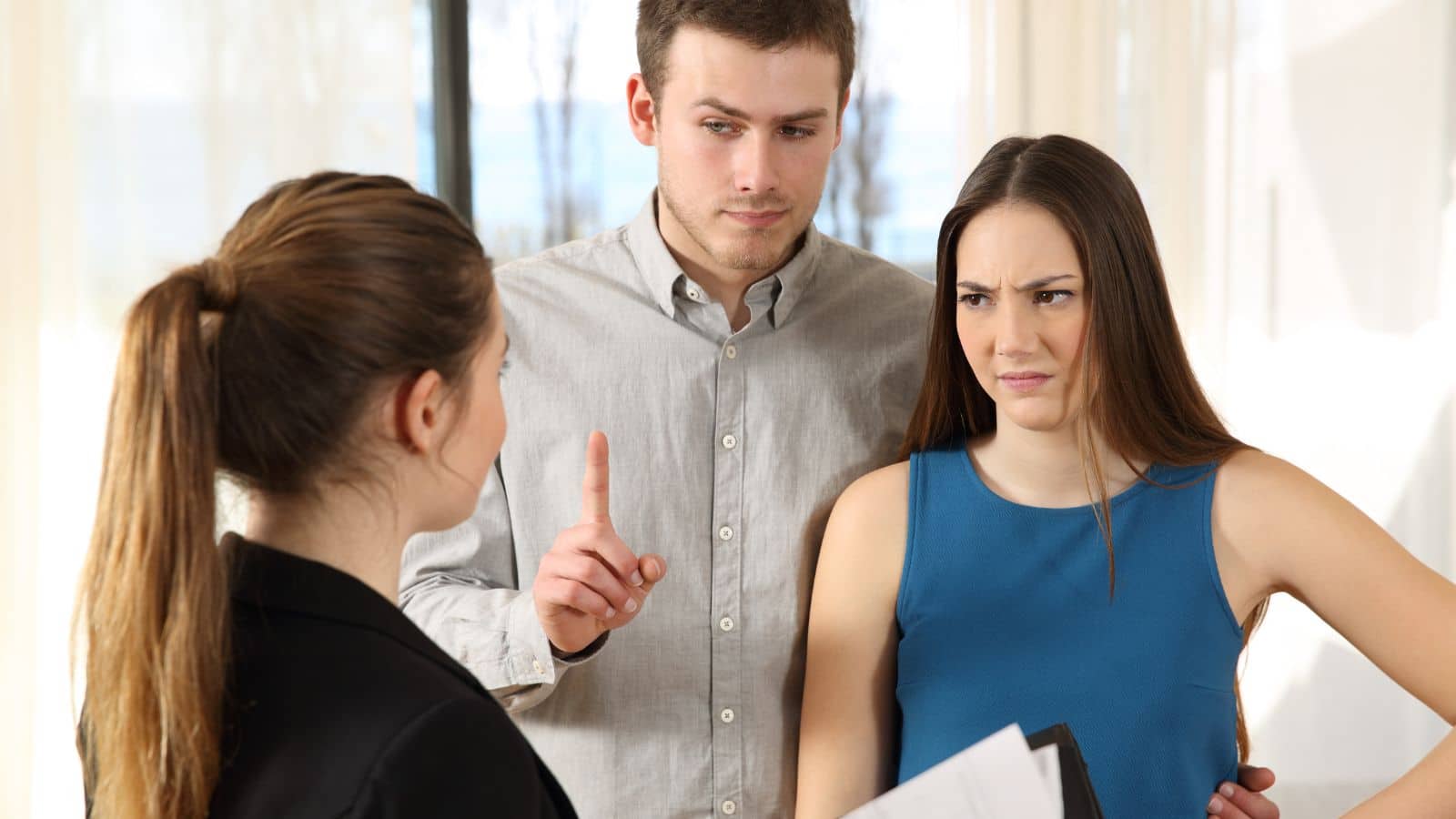 Couple looking annoyed with their realtor