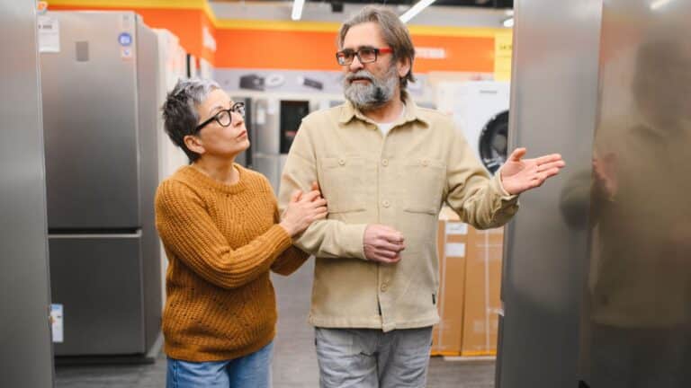 Couple walking through an appliance store