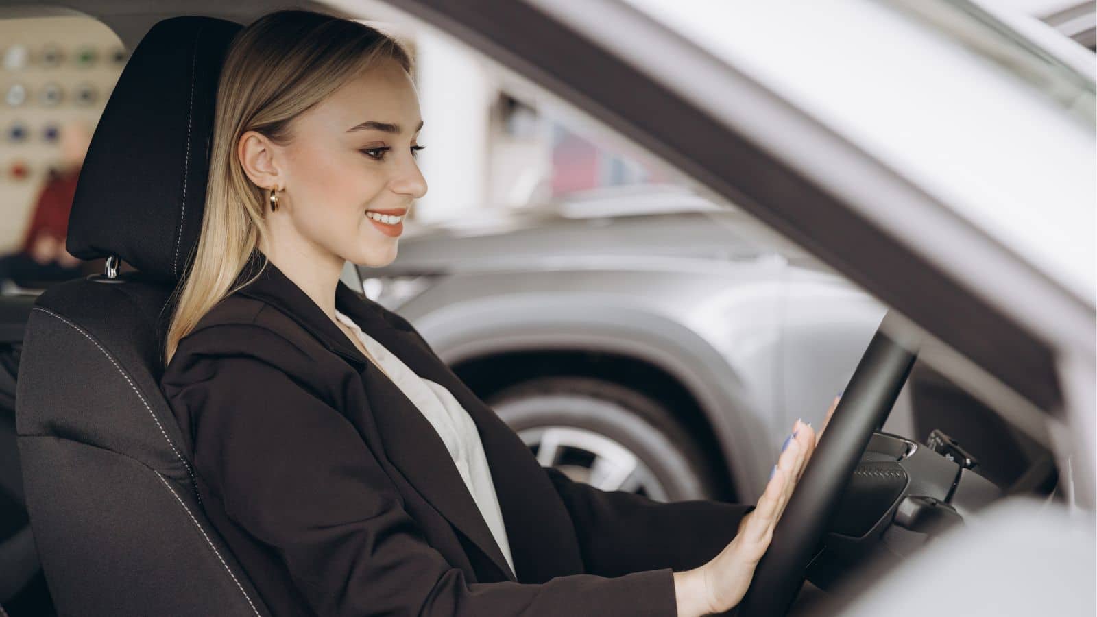 Young woman sitting in a car