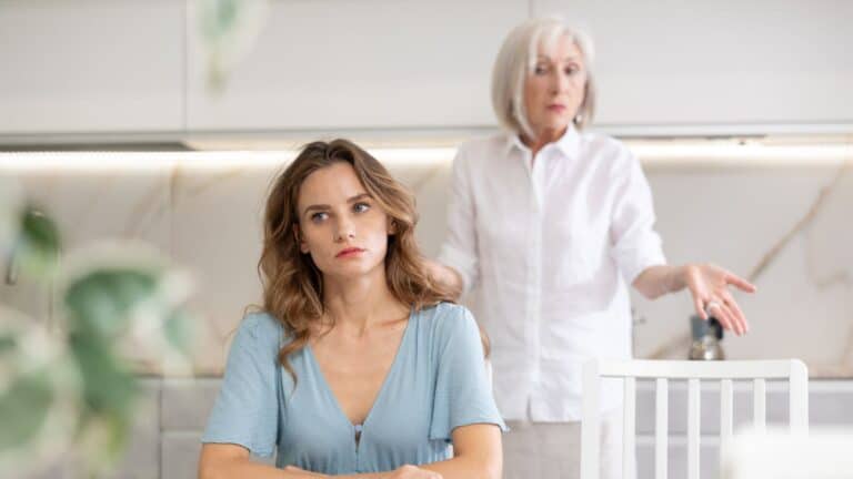 Older woman looking angry with adult woman
