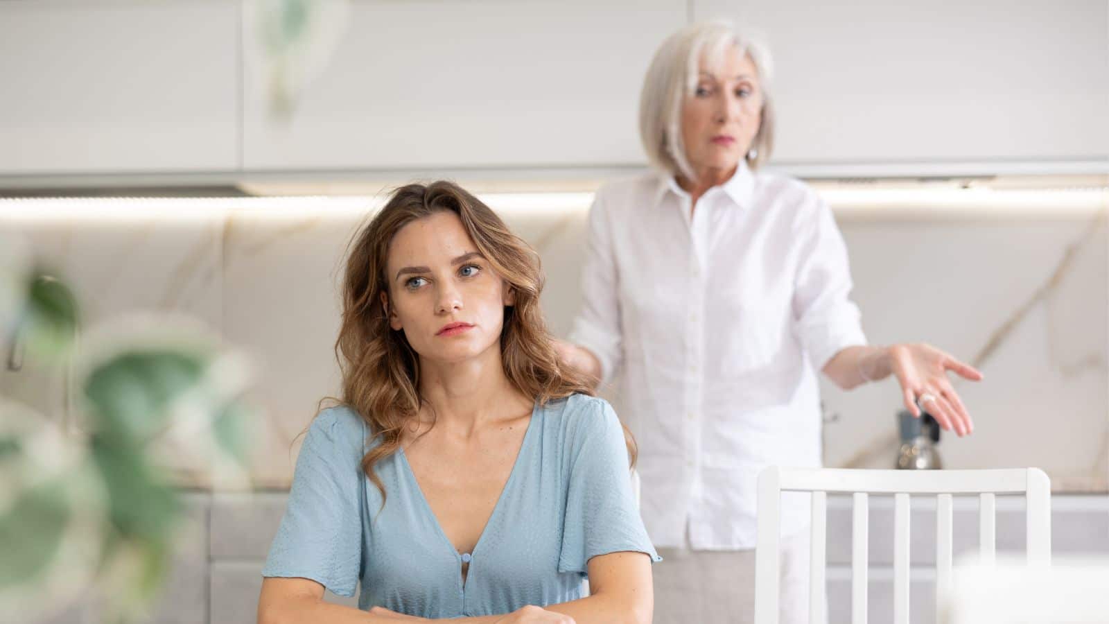 Older woman looking angry with adult woman