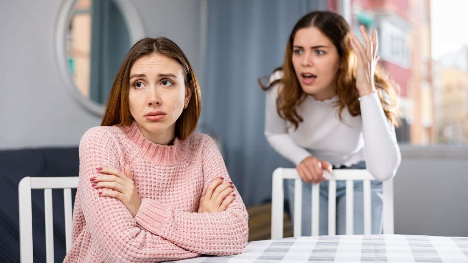 Friends fighting at the table
