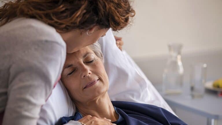 Adult daughter visiting with sick mother