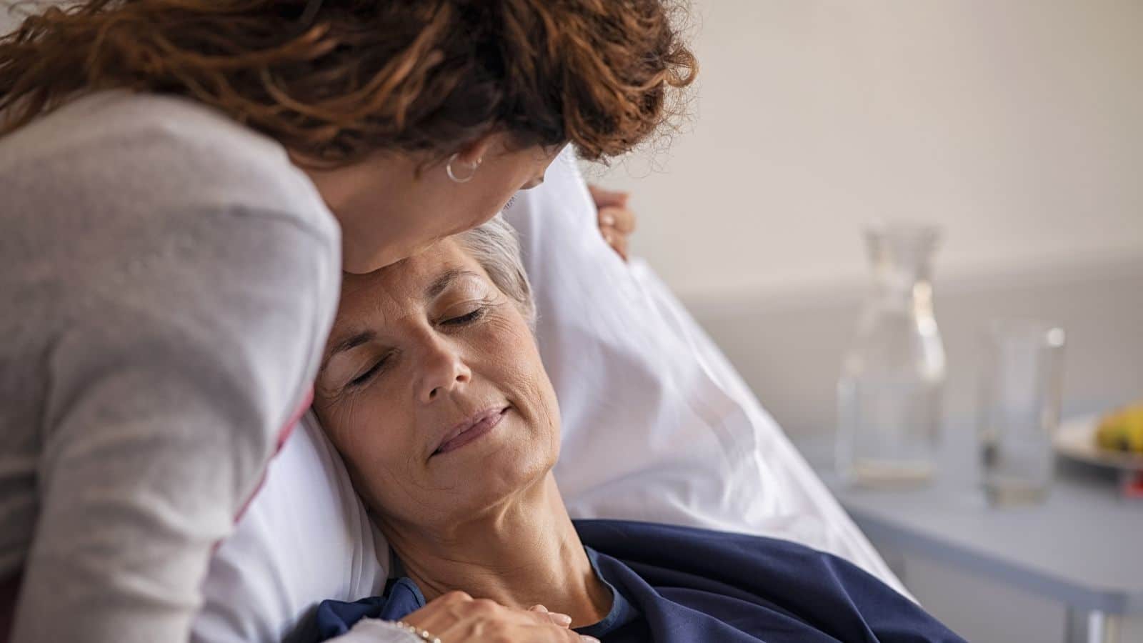 Adult daughter visiting with sick mother