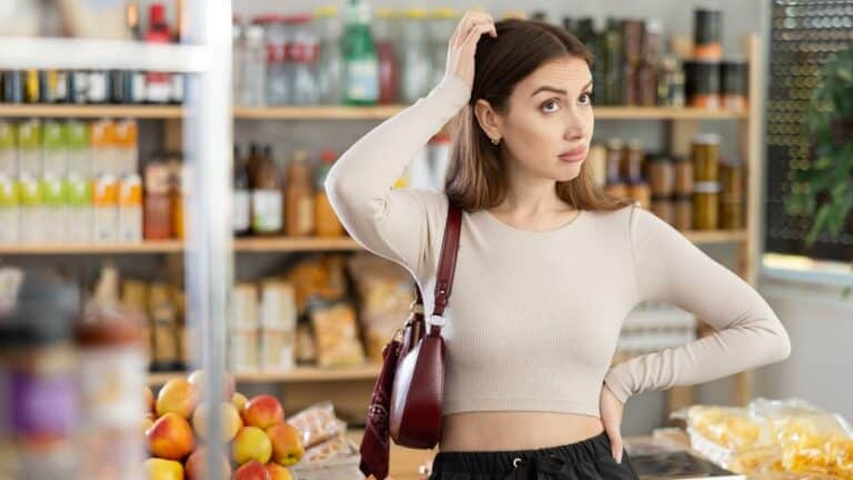 Young woman looking confused in the grocery store