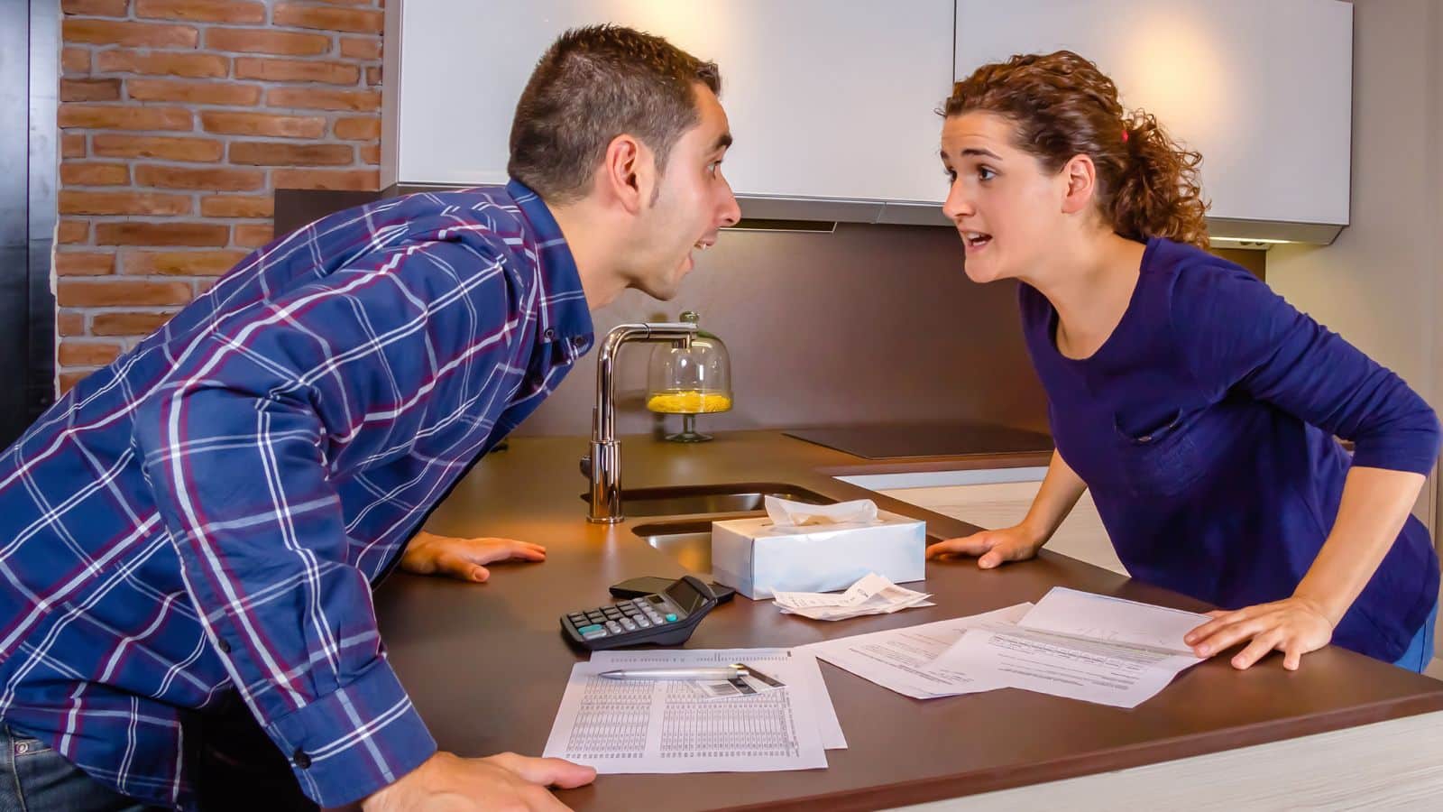 Young couple arguing over money